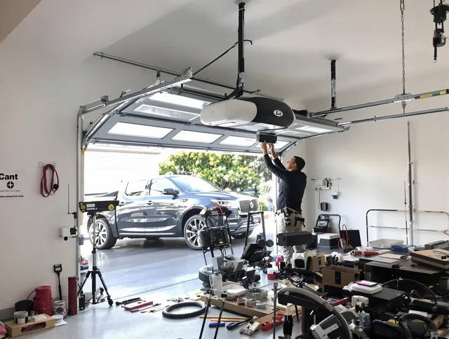 Kissimmee Garage Door Repair specialist installing smart garage door opener system in Kissimmee home